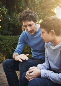 A boy confesses his misdeed to his dad (stock image).