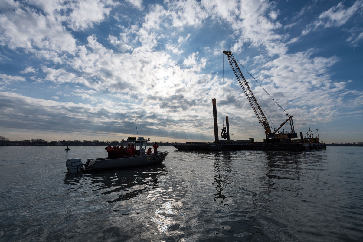A view of the reef-building barge and crane during construction on the Detroit River, just upstream of Belle Isle, in early December. Image credit: Austin Thomason, Michigan Photography