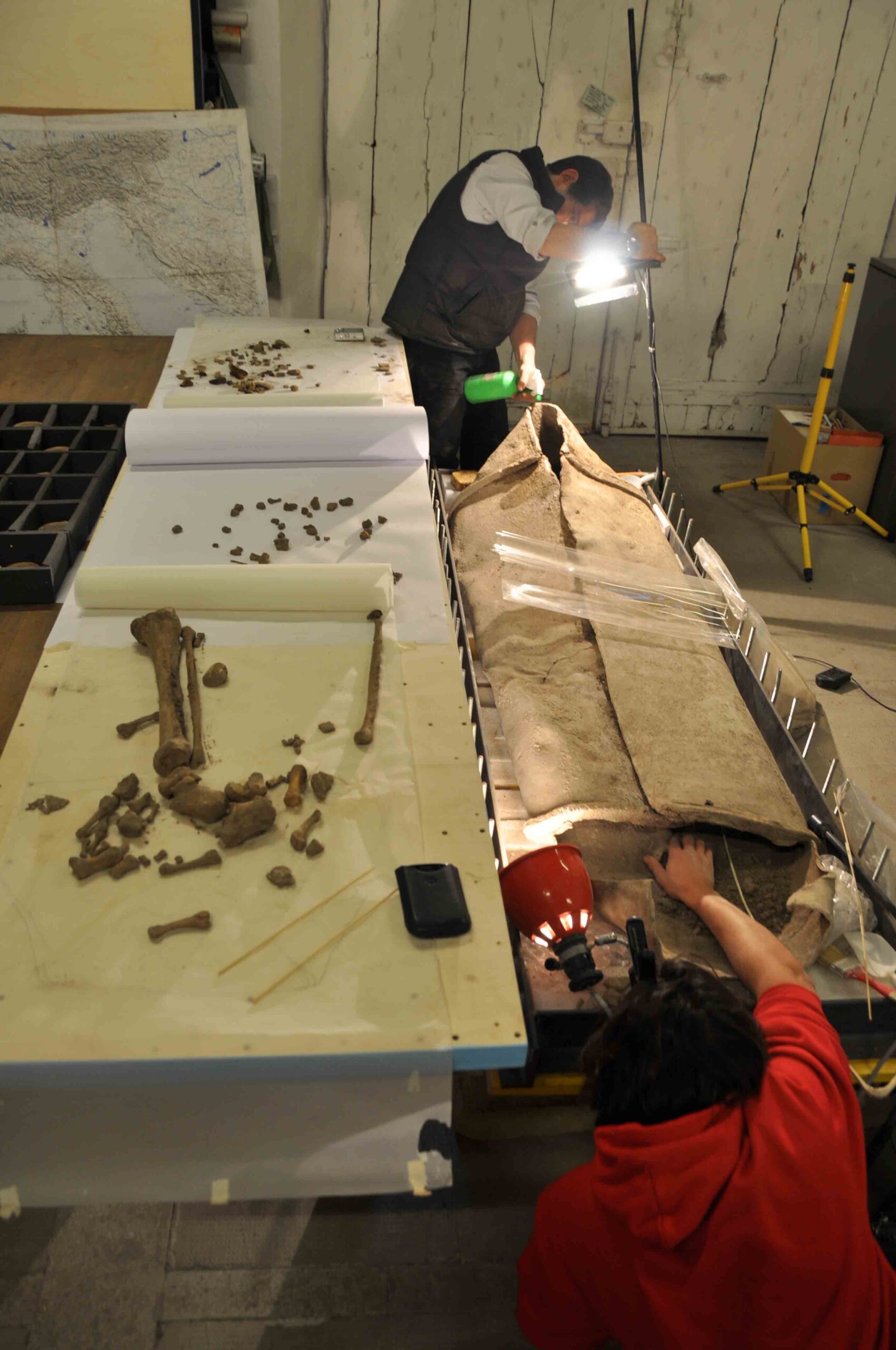 The content of the lead coffin was excavated in the lab at the American Academy in Rome. The lead sheets wrapped the body of an adult male individual who died around the age of Nero, whose skeletal remains are visible on the left. No grave goods were found, but the disposal of 500 pounds of metal is in itself a sign of the high status of the deceased.