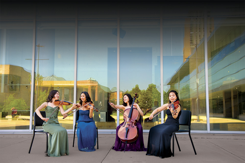 The Evita Quartet is the graduate string quartet in residence at the University of Michigan School of Music, Theatre & Dance. Hyorim Han & Haerim Liz Lee (violins), Yi-Chun Lin (viola), Soojung Kim (cello). Photo by Eric Bronson, Michigan Photography.