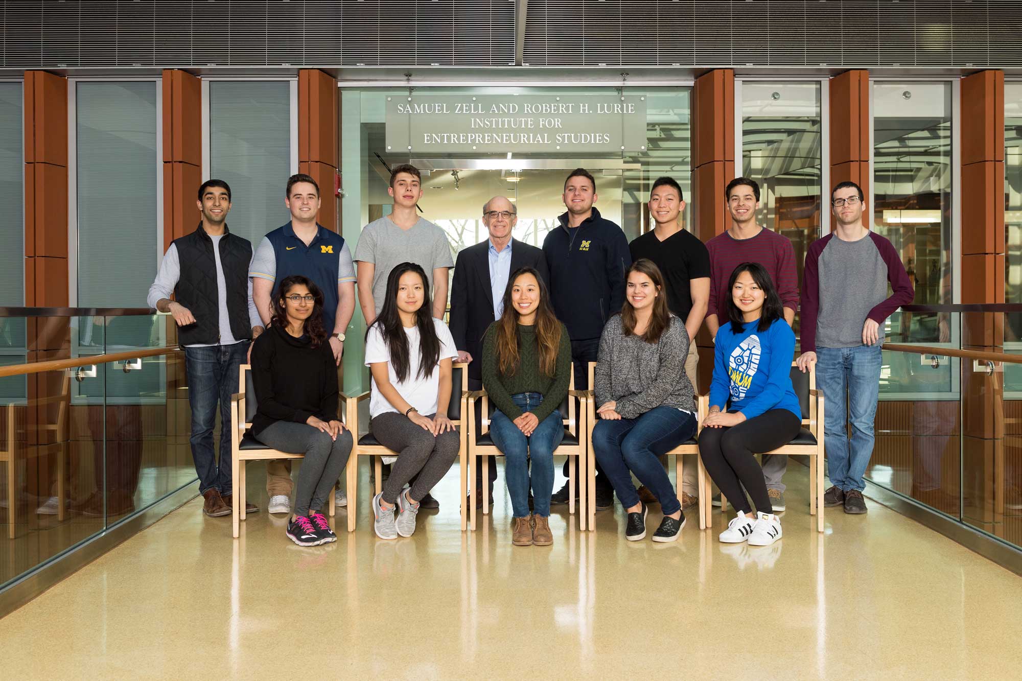 Erik Gordon, assistant clinical professor at the University of Michigan's Ross School, stands with his students -- the first group of undergraduates to work on a venture capital fund at U-M. The Zell Early Stage Fund is the fifth offered at the Zell Lurie Institute. The other four are strictly for MBA students.