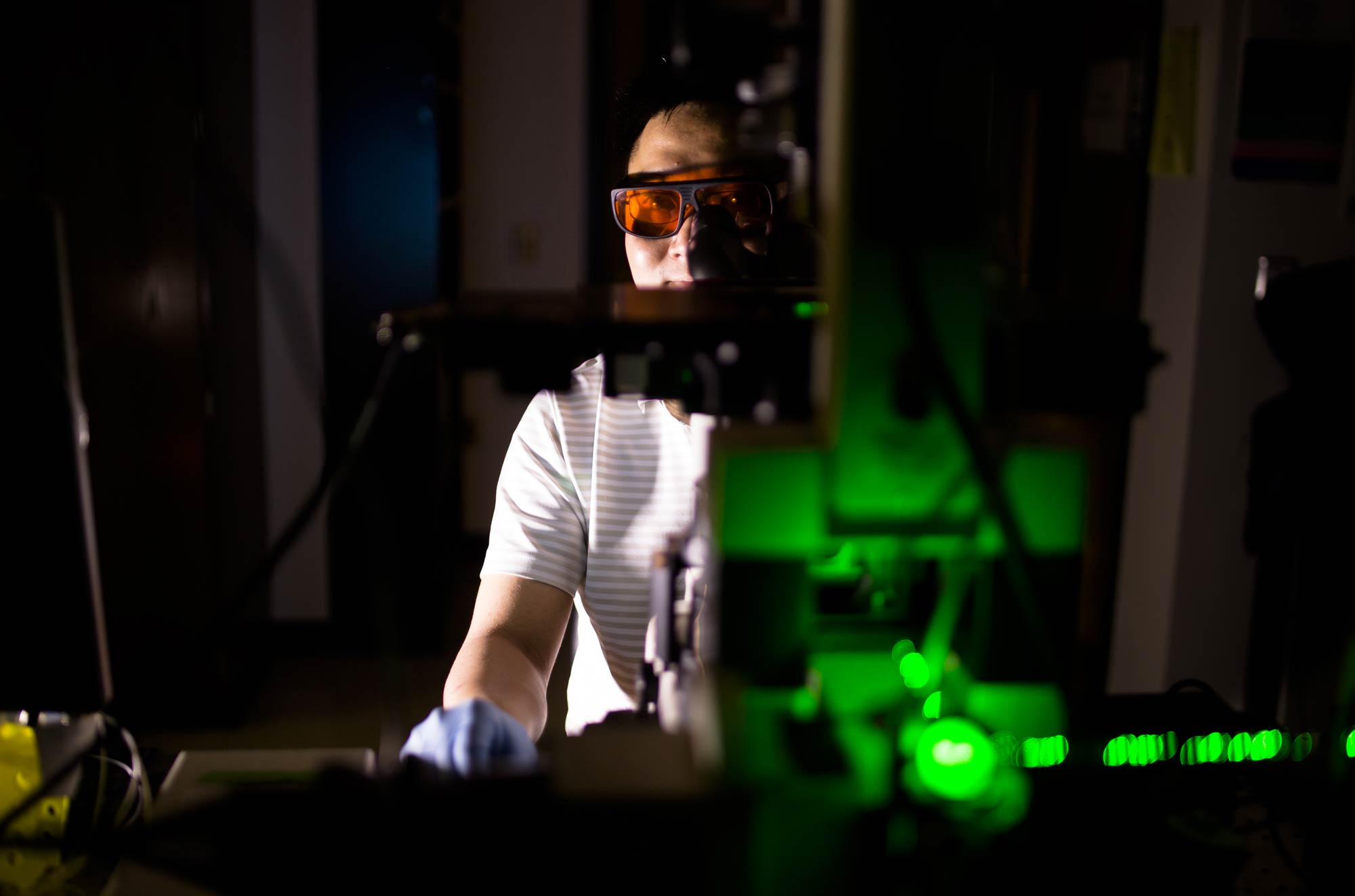 Yu-Chih Chen, a research scientist in electrical engineering and computer science, helped to develop a chip that can gently release individual cells, targeted with extremely short laser pulses. Image credit: Evan Dougherty, Michigan Engineering