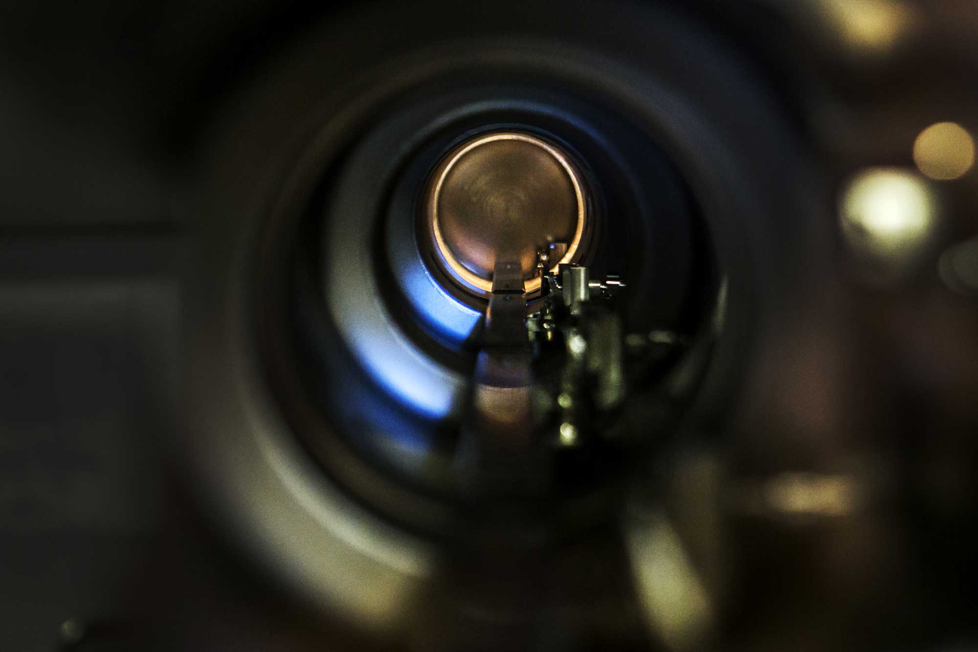 The inside of the main concourse of the molecular beam epitaxy apparatus, which University of Michigan engineering researchers used to make the advanced nanoparticle-infused gallium nitride semiconductors. The semiconductors could boost LED efficiency by up to 50 percent, and even lead to invisibility cloaking devices. Image credit: Joseph Xu, Michigan Engineering