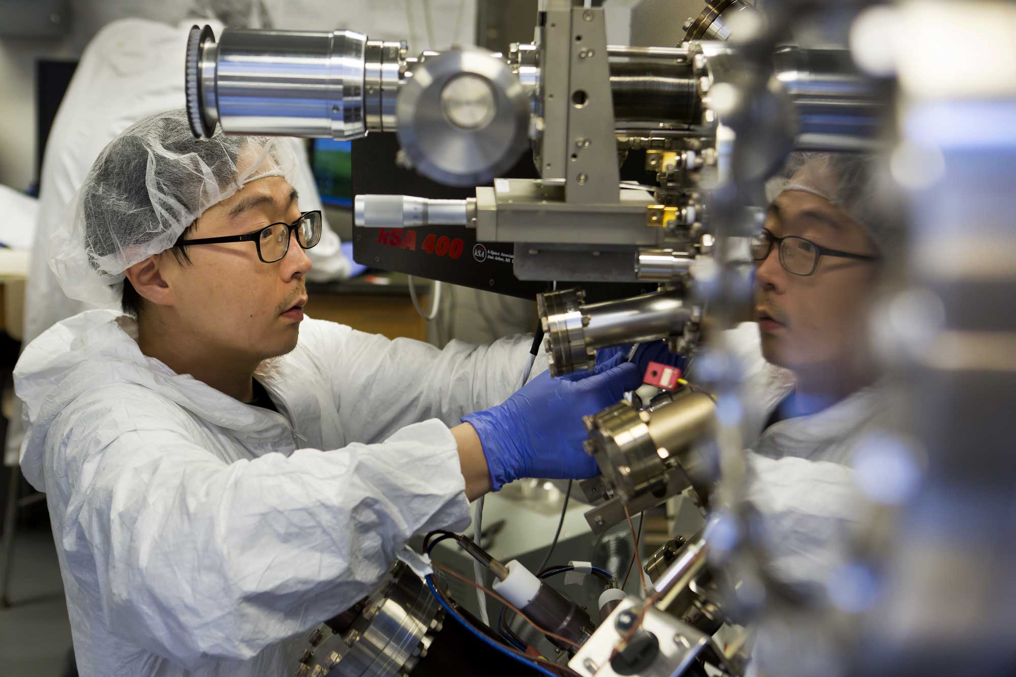 Former materials science PhD student Sunyeol Jun prepares the molecular beam epitaxy apparatus that’s used to make the nanoparticle-infused gallium nitride semiconductors. The semiconductors could boost LED efficiency by up to 50 percent, and even lead to invisibility cloaking devices. Image credit: Joseph Xu, Michigan Engineering