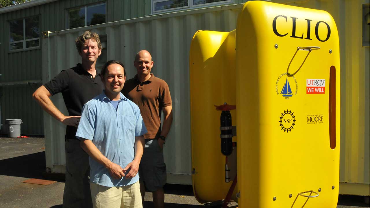 Principal investigators John Breier of UTRGV (left), Mak Saito (center) and Mike Jakuba of WHOI, with the AUV Clio— the world's first underwater vehicle designed specifically to collect both biological and chemical samples from the ocean water column. Image credit: Katherine Spencer Joyce, Woods Hole Oceanographic Institution