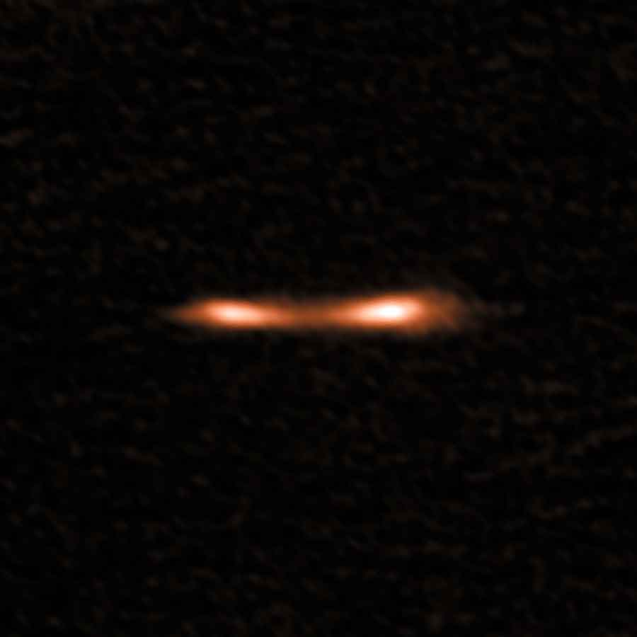 This ALMA image shows the Cosmic Eyelash, a remote starburst galaxy that appears double and brightened by gravitational lensing. ALMA has been used to detect turbulent reservoirs of cold gas surrounding this and other distant starburst galaxies. By detecting carbon hydride for the first time in the distant universe, this research opens up a new window of exploration into a critical epoch of star formation. Image Credit: ALMA (ESO/NAOJ/NRAO)/E. Falgarone et al.