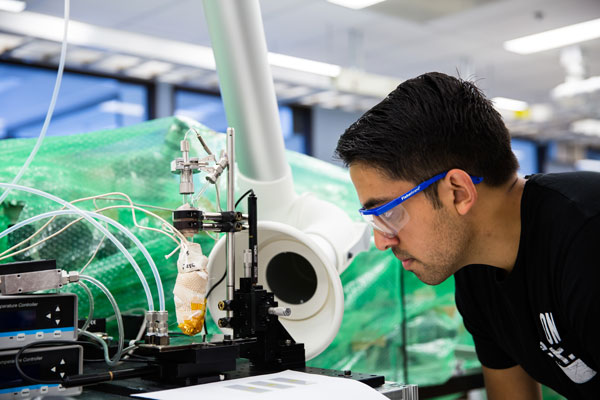Graduate student research assistant Siddharth Suresh Borsadia prints fluorescein crystals onto a cooled glass plate using organic vapor jet printing. Image Credit Levi Hutmacher, Michigan Engineering
