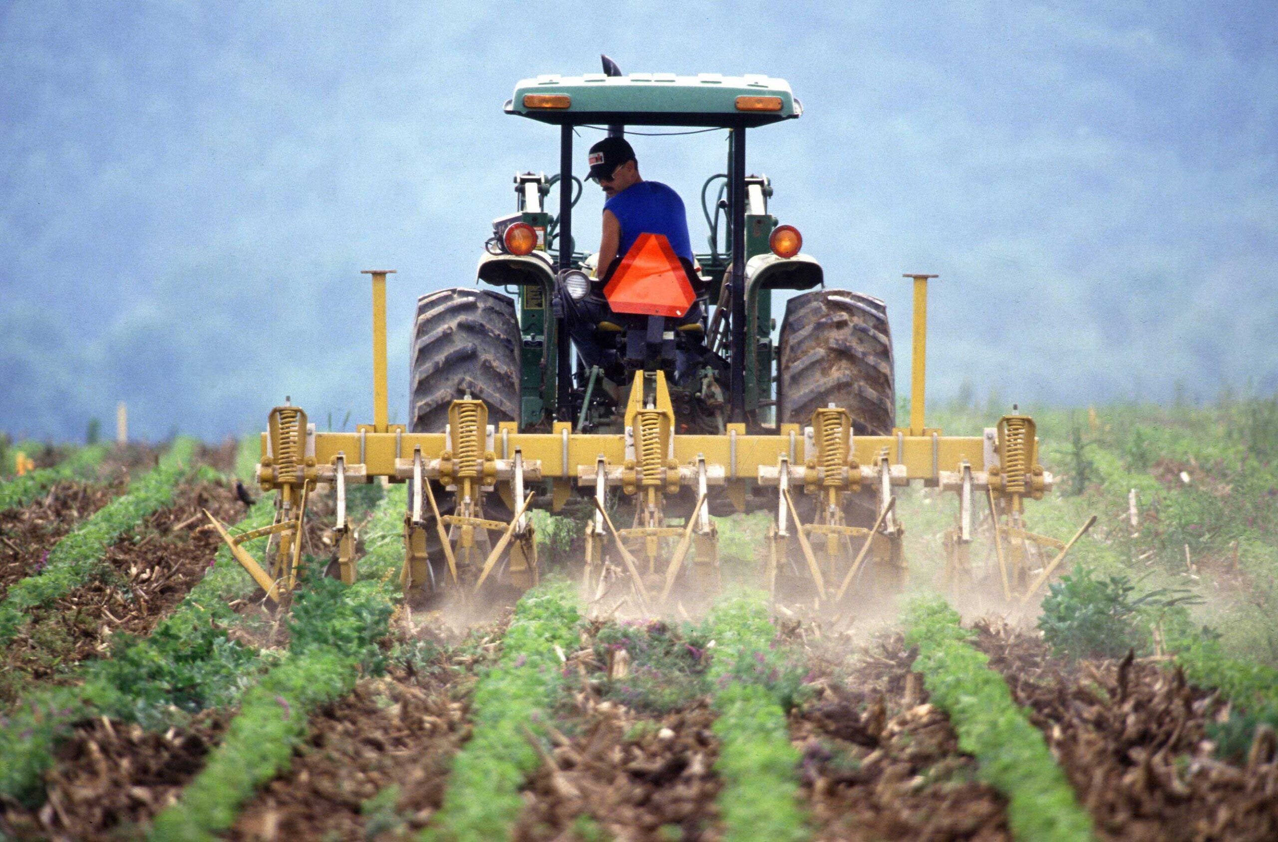 A farmer tilling soil. New research finds that reduced tillage and other land management practices could increase soil’s carbon storage enough to offset future carbon emissions. Image credit: Keith Weller, U.S. Department of Agriculture