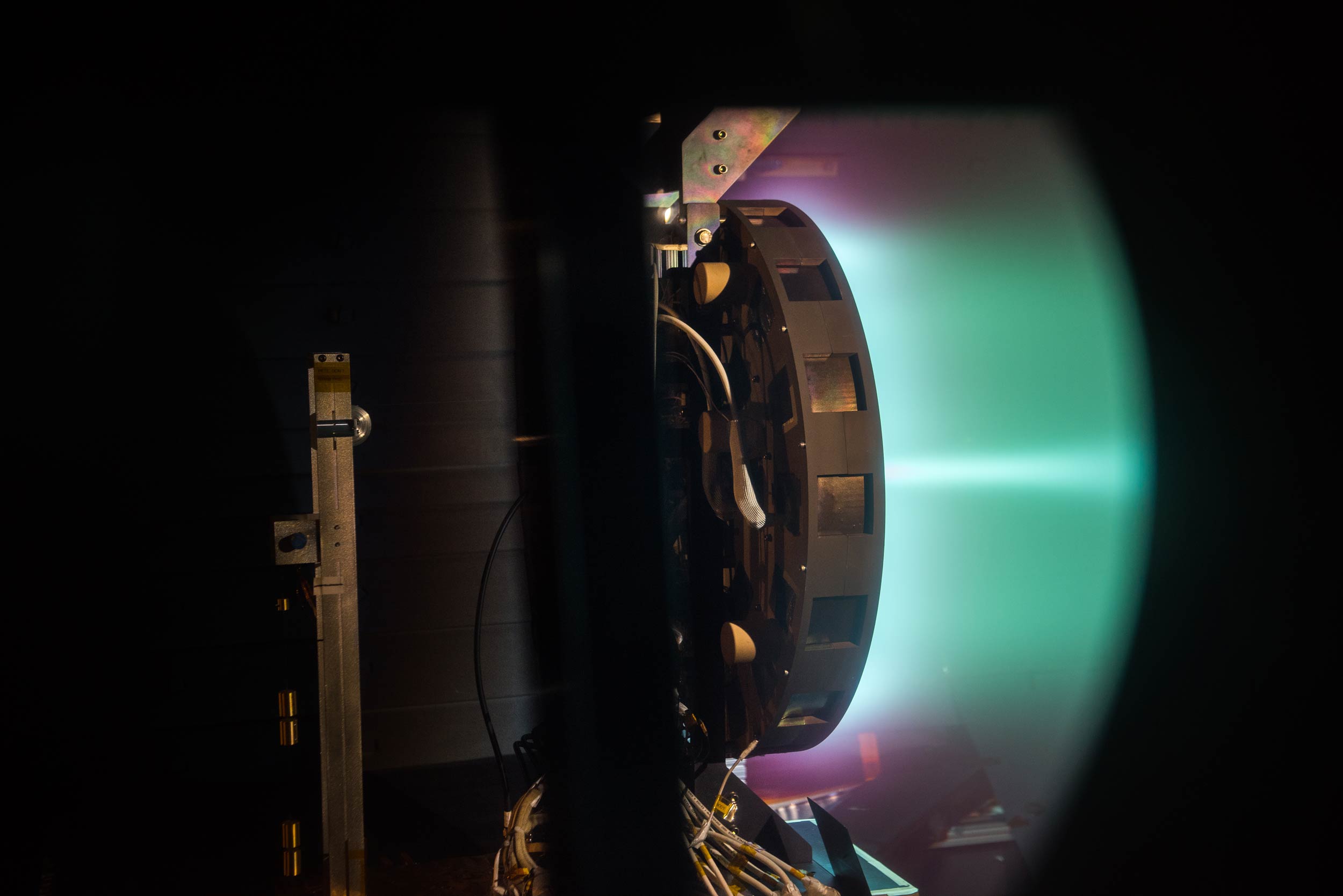 A side shot of the X3 firing at 50 kilowatts. Image credit: NASA