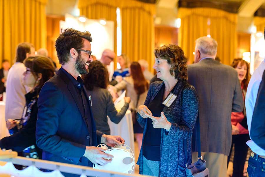Two attendees chat at the 2016 Celebrate Innovation event. Image courtesy: U-M Tech Transfer