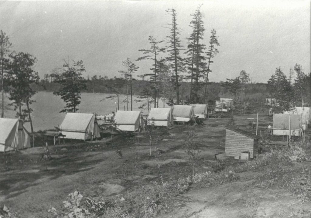 Residential tents at the University of Michigan Biological Station near Pellston, circa 1914, following a period of heavy logging and frequent wildfires. Ten women and four men were in the inaugural class of students in 1909. Image credit: U-M Bentley Historical Library