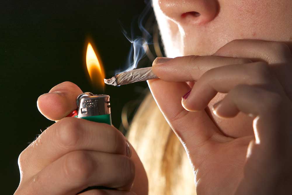 Smoking. Image credit: Flickr.com user Chuck Grimmett