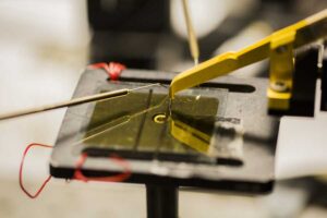 An organic solar cell testing inside the Randall Lab. University of Michigan researchers have found a way to coax electrons to travel much further than was previously thought possible in the materials often used for organic solar cells and other organic semiconductors. Image credit: Robert Coelius, Michigan Engineering