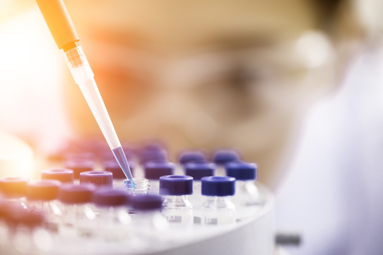 Female chemist at work in laboratory. (stock image)