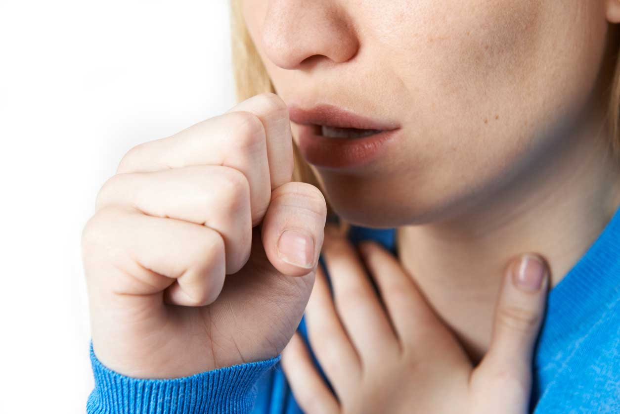 Close up of woman wuffering with a cough. (stock image)