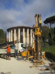 Researchers used a hydraulic drilling rig to take core samples behind the Temple of Portunus in 2015. Image credit: Andrea Brock