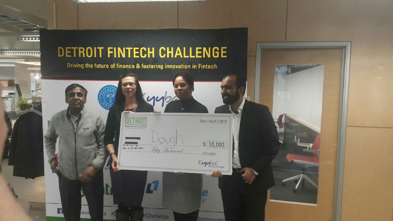 Catalina Kaiyoorawongs(second from left)andYahya Bajwa (right) team took home $50,000 after winning Detroit’s Fintech Challengefor their startup Dough.Vic Heverle (left) and April Davis (second from right) mentored them through the process of creating Dough.