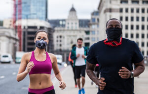 Joggers wear masks in Central London