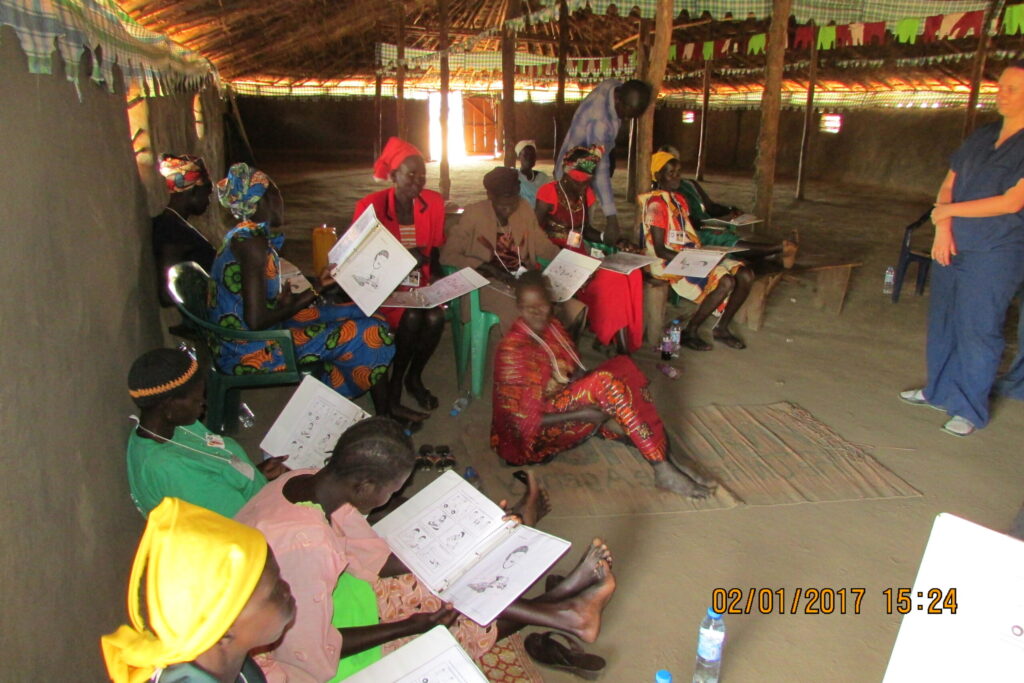 Participants leave the workshop with picture cards so they can share the information with the community.