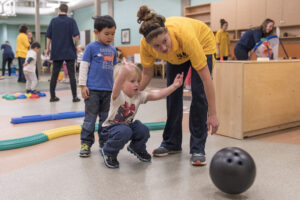 Children move among activity stations to learn core motor skills. Unlike traditional movement curricula, children here can pick their activity and the difficulty level.