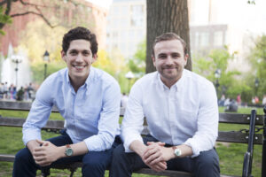 Nick Martell and Jack Kramer sitting on a bench