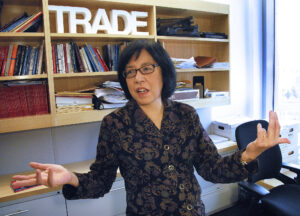 Linda Lim with hands out speaking