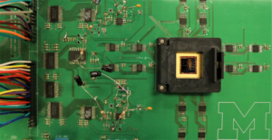The memristor array situated on a circuit board.