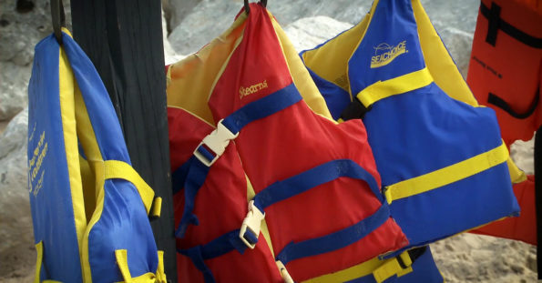 life jackets hanging on hook