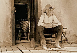 Gus on the Front Porch (© 1988 Bill Wittliff, Courtesy of the Wittliff Collections, Texas State University.)