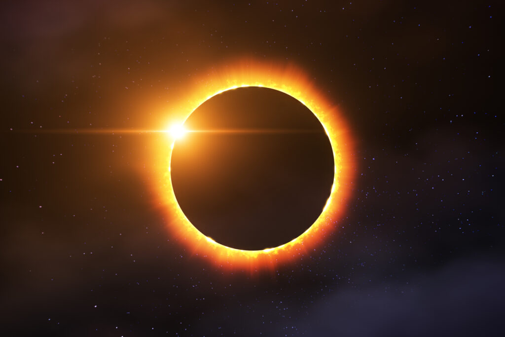 A total solar eclipse combined with stars and some clouds. Image credit: iStock
