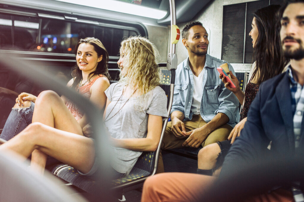 People riding city metro bus. iStock image
