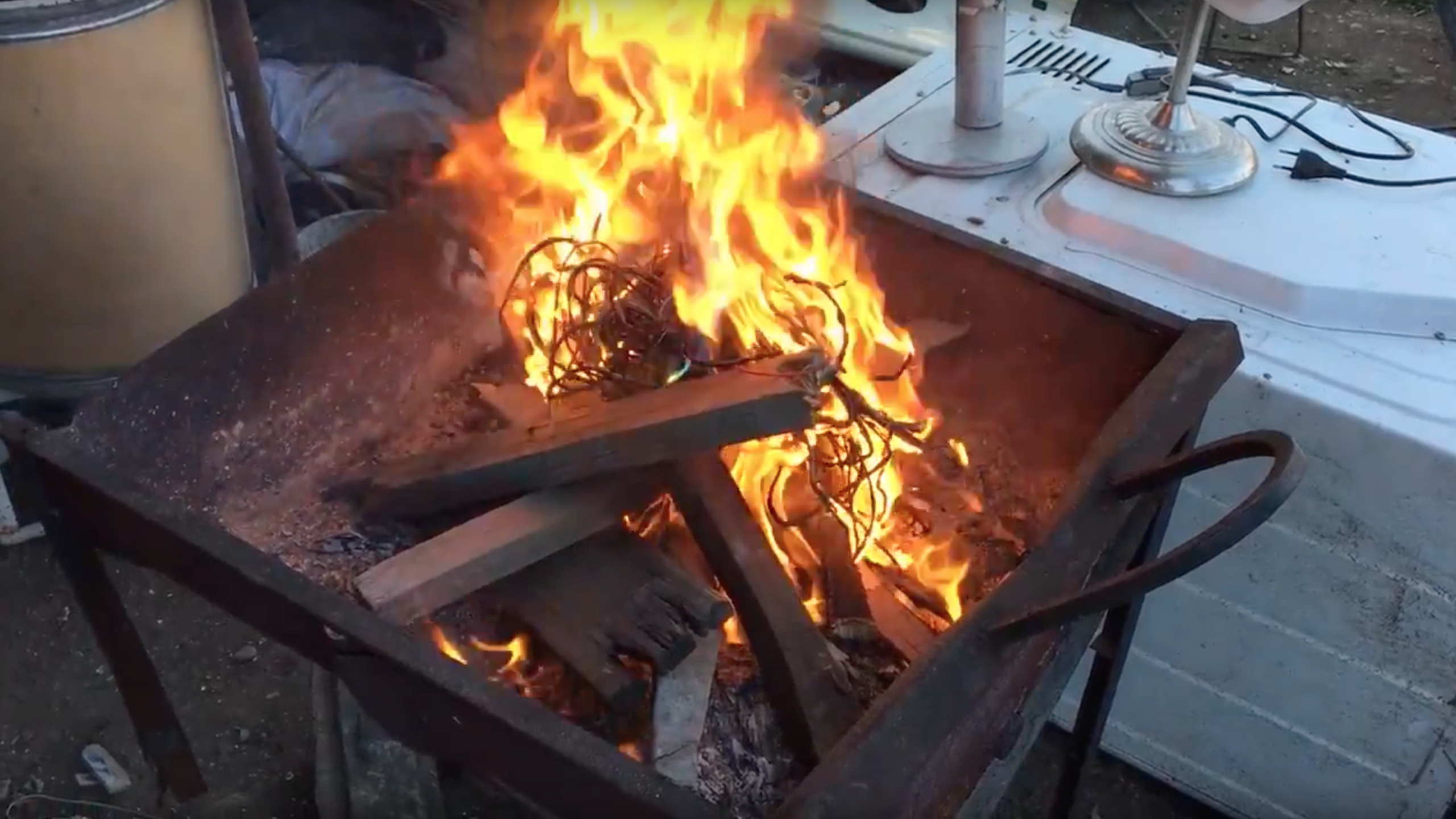 To get to the copper within, wires are burned in a grill in Santiago, Chile.