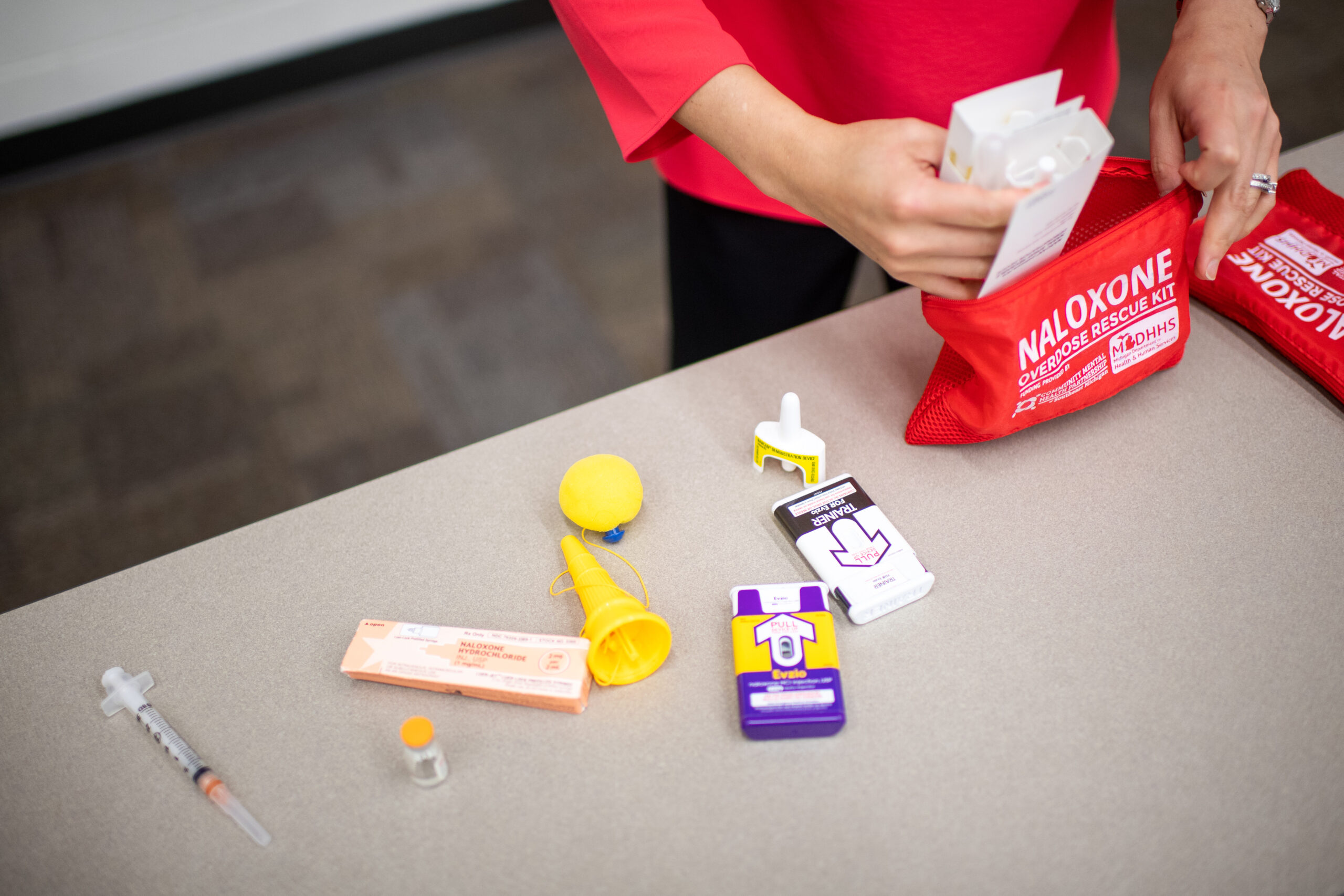 Dahlem packs a naloxone kit. Image credit: Chris McElroy, Michigan Photography