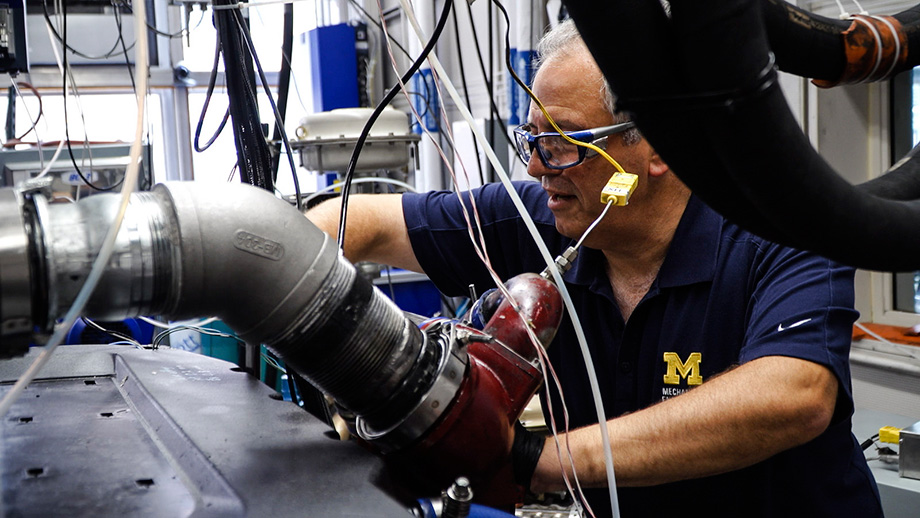 Photo of Andre Boehman in the W.E. Lay Automotive Laboratory