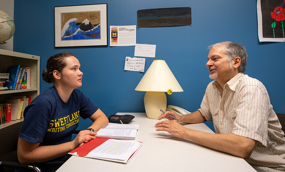 Photo of student Anna Horton talking with LSA lecturer Louis Cicciarelli