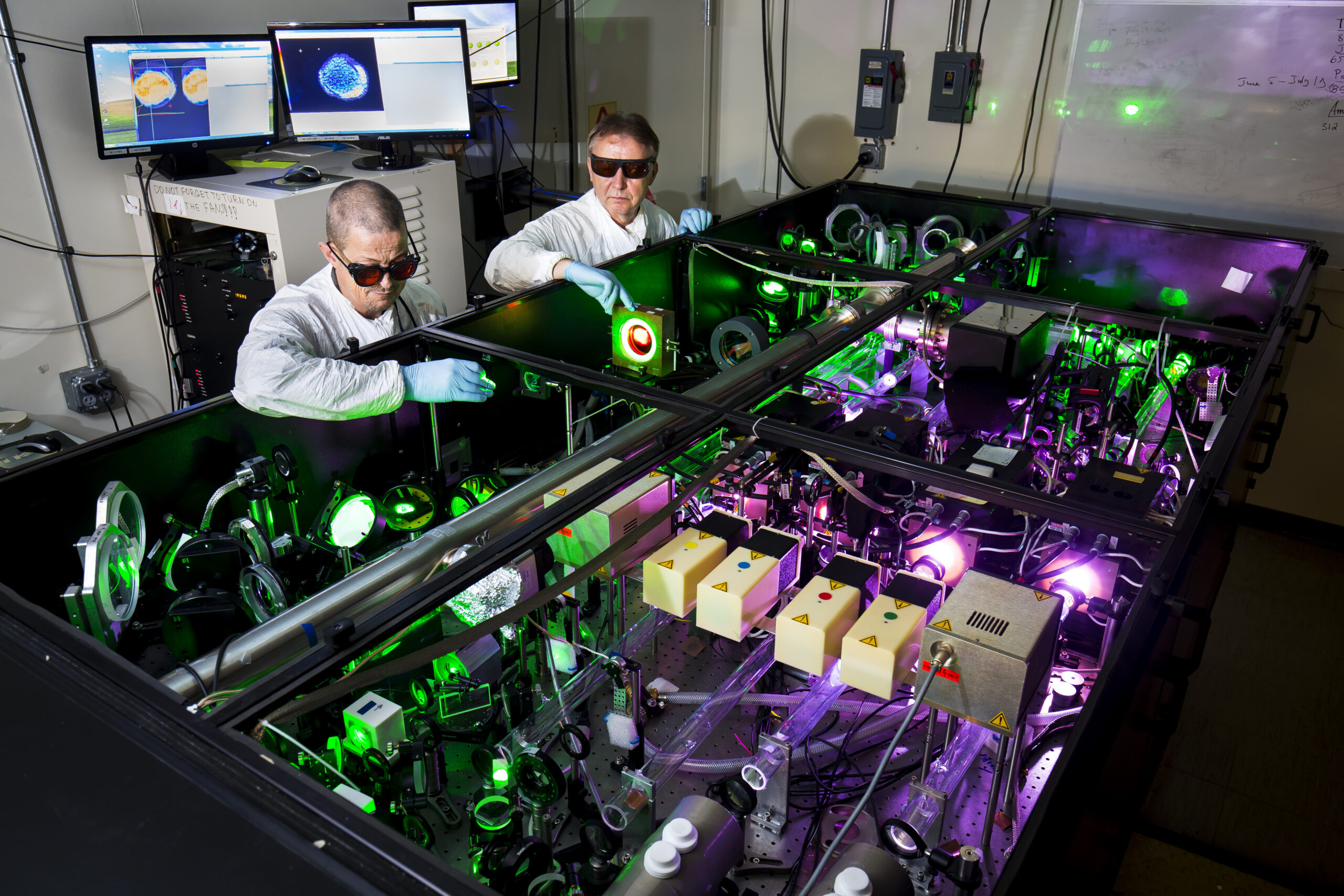 Anatoly Maksimchuk, EECS Research Scientist, and John Nees, EECS Associate Research Scientist, demonstrate use of the HERCULES 300 TW laser. Image credit: Joseph Xu