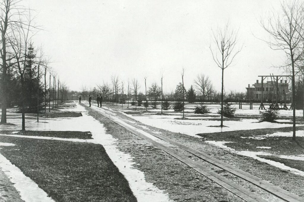 The wide-open Diag, about 1870, looking southeast. At right, one of the four early houses built for professors is visible. One of them, which had become the President’s House, would have been just outside the frame at right.