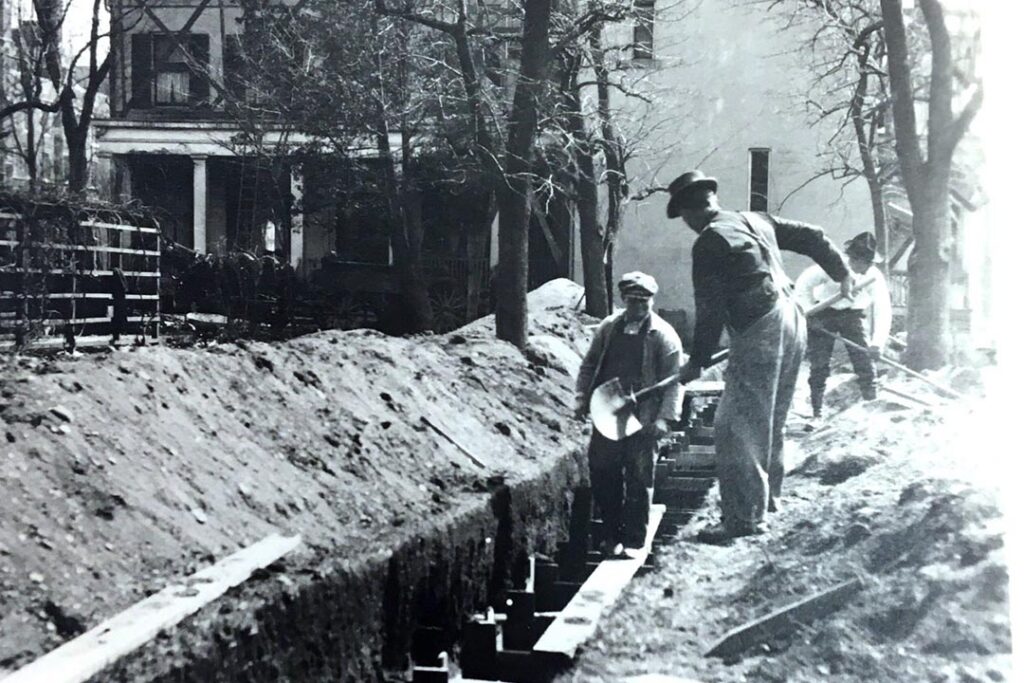 Workers dig trenches for the president’s plumbing.