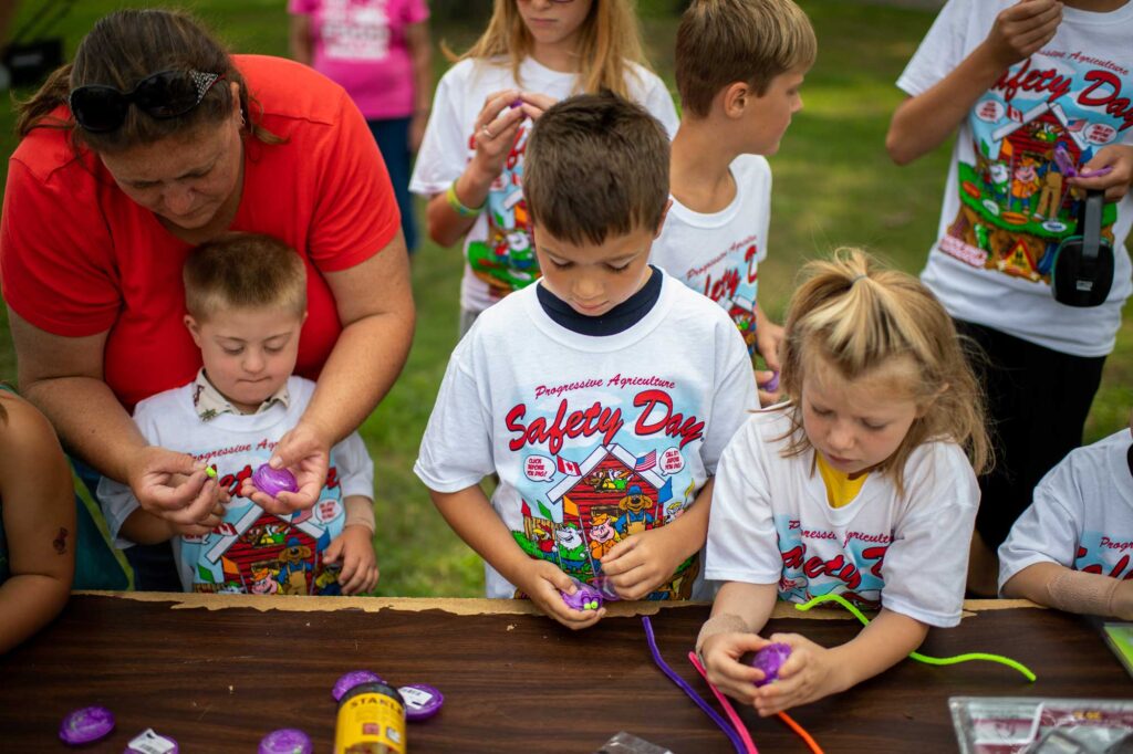 Kids learn about hearing protection at Safety Day. Image credit: Michigan Photoraphy