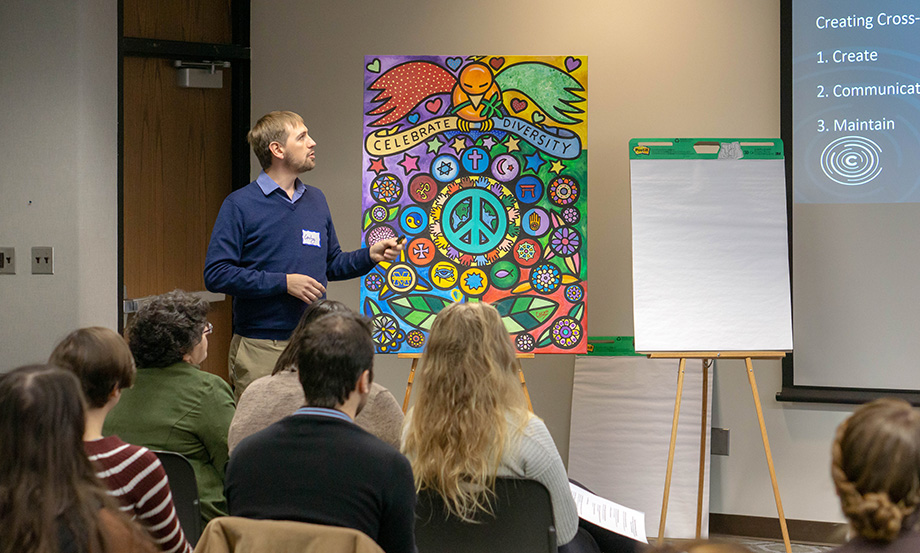 Photo of Convergence founder and executive director Cody Nielsen walkin participants through the 4 Pillars of Interfaith Engagement.