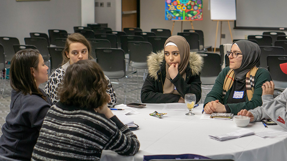 Photo of students and staff from the University of Detroit Mercy developing their campus action plan