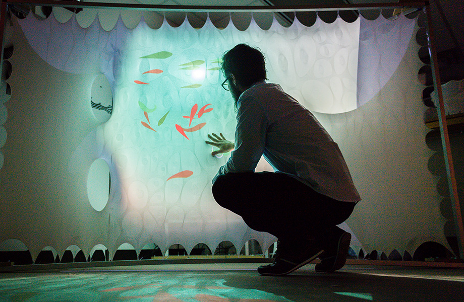 Photo of Sean Ahlquist using one of his tensile structures