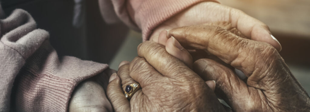 Holding elderly hands. Image courtesy: Wayne State University