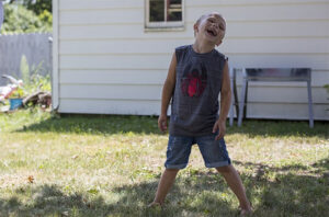 Landyn plays in his backyard.