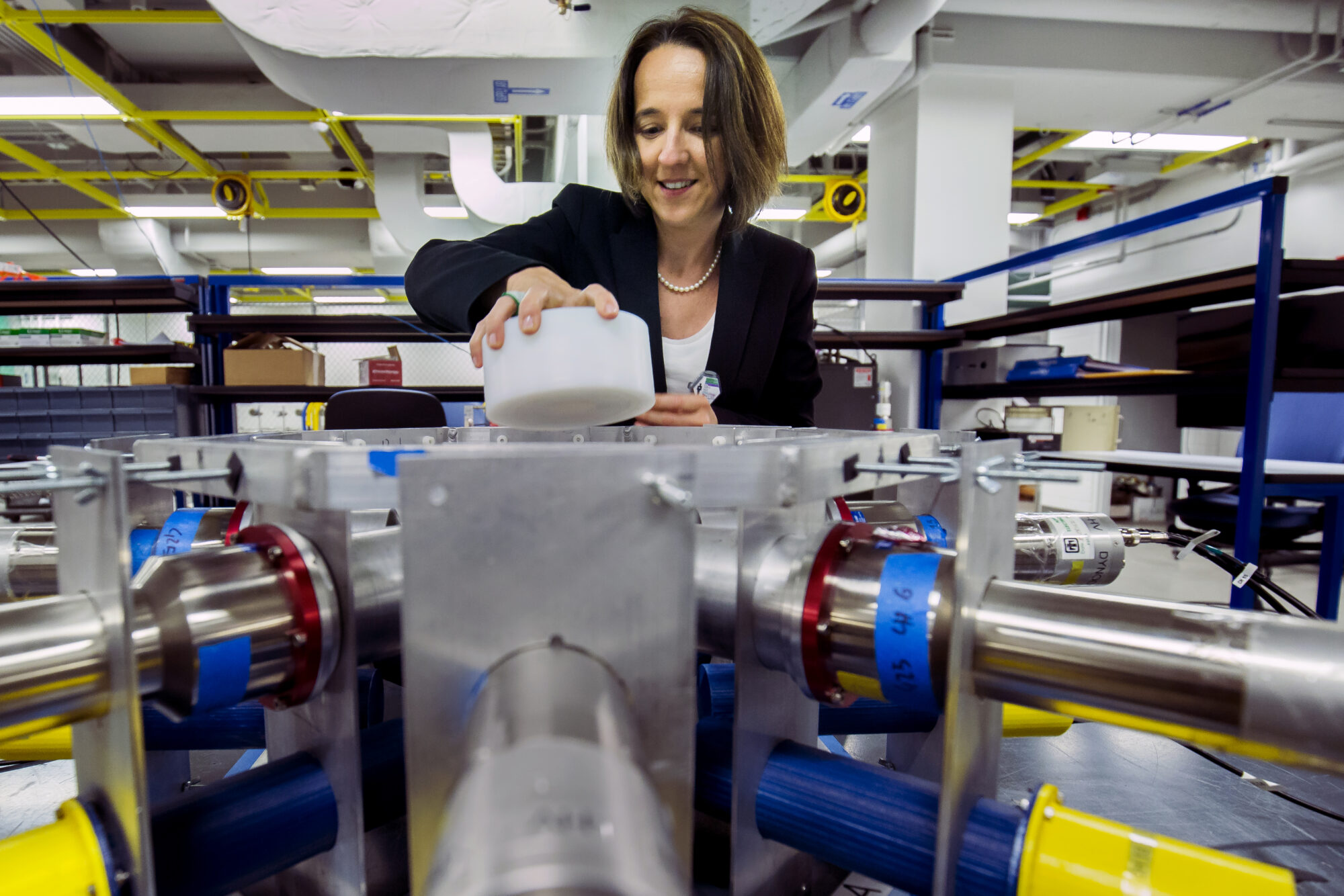 Sara Pozzi puts a radioactive sample into an array of detectors that identify and measure uranium and plutonium. Image credit: Joseph Xu, Michigan Engineering