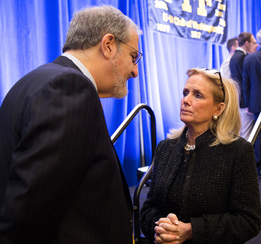 Photo of President Mark Schlissel speaking with U.S. Rep. Debbie Dingell