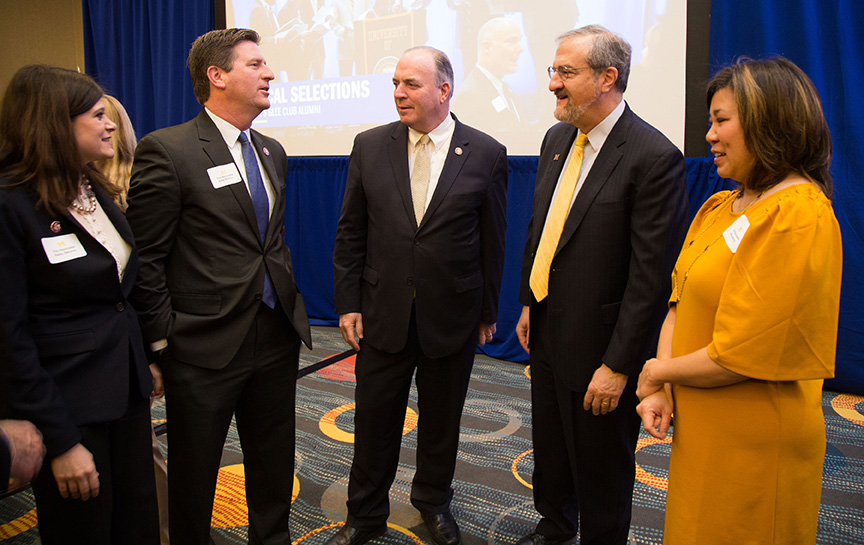 Photo of, from left, U.S. Reps. Haley Stevens, Greg Stanton, Dan Kildee, President Mark Schlissel and U.S. Rep. Grace Meng
