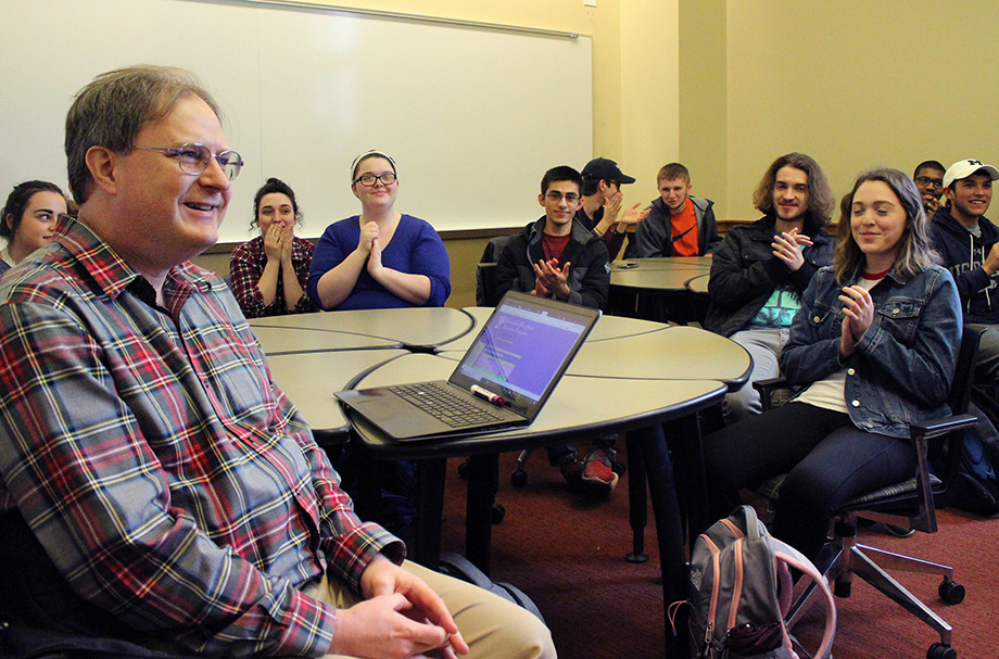 Photo of Mark Conger during the surprise presentation of the Golden Apple Award
