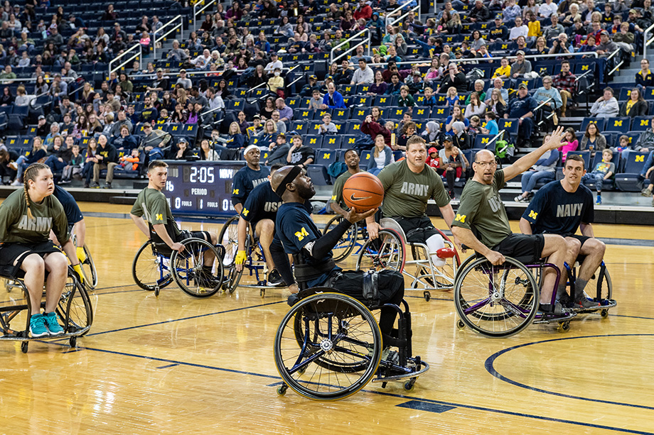 Photo of wheelchair basketball player moving the ball