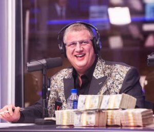 Derek Stevens with money